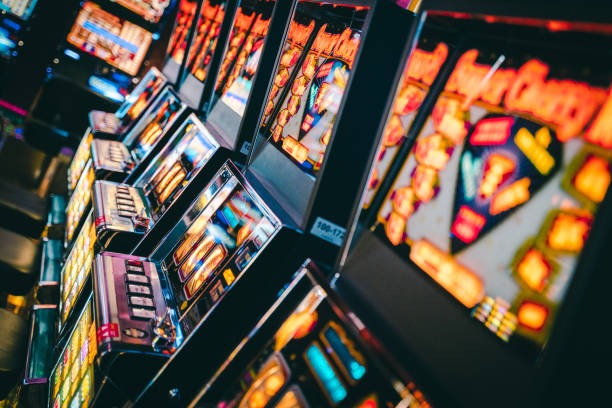 Jewels of Prosperity slot game interface showing gem symbols and spin controls